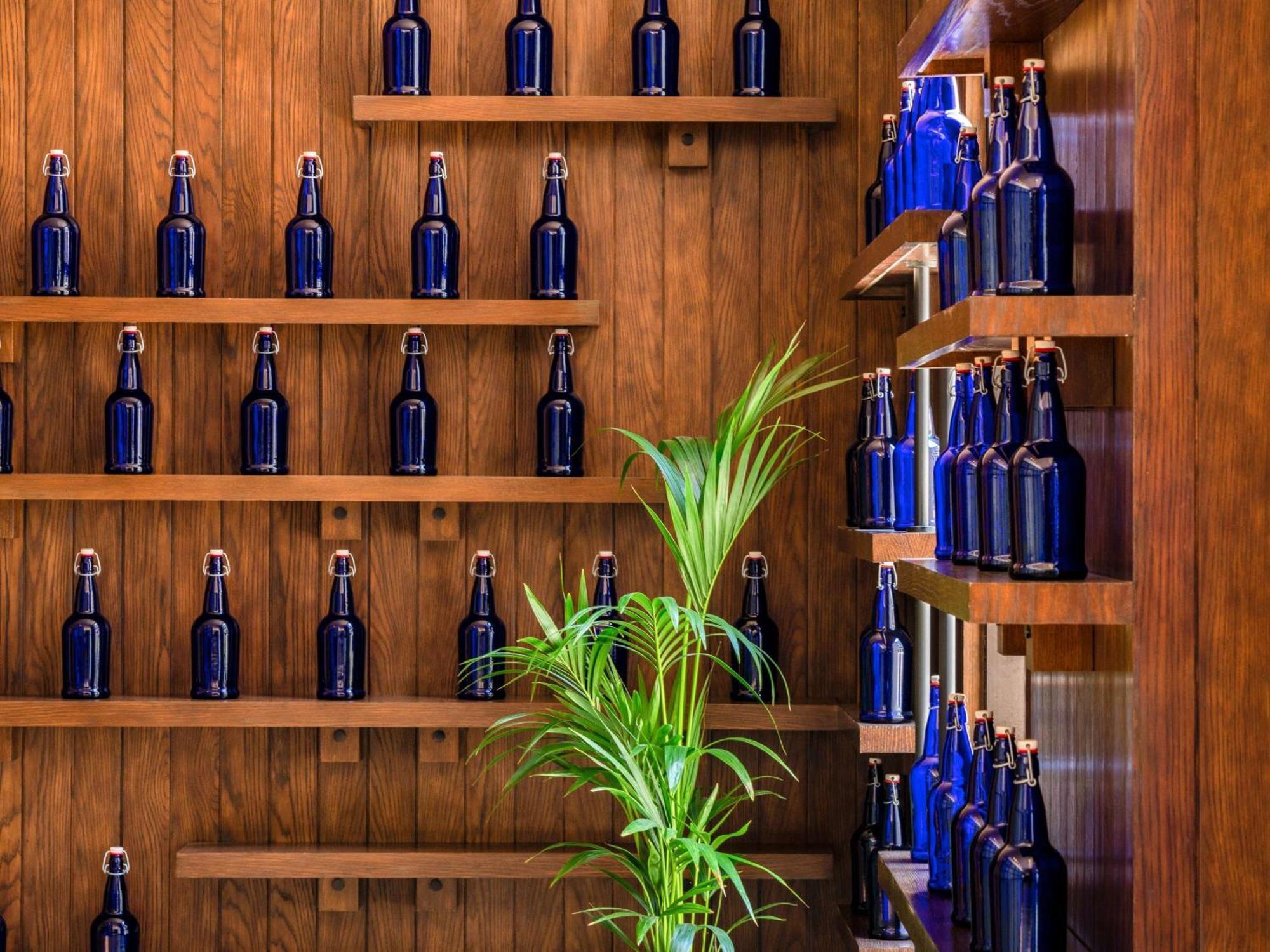 Alwadi Hotel Doha - Mgallery Exterior foto Blue bottles at the Blue Bottle Coffee headquarters in San Francisco